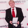 Joe Longthorne receiving the ' Silver Heart' Award from Variety Club The Children's Charity' in 2010.